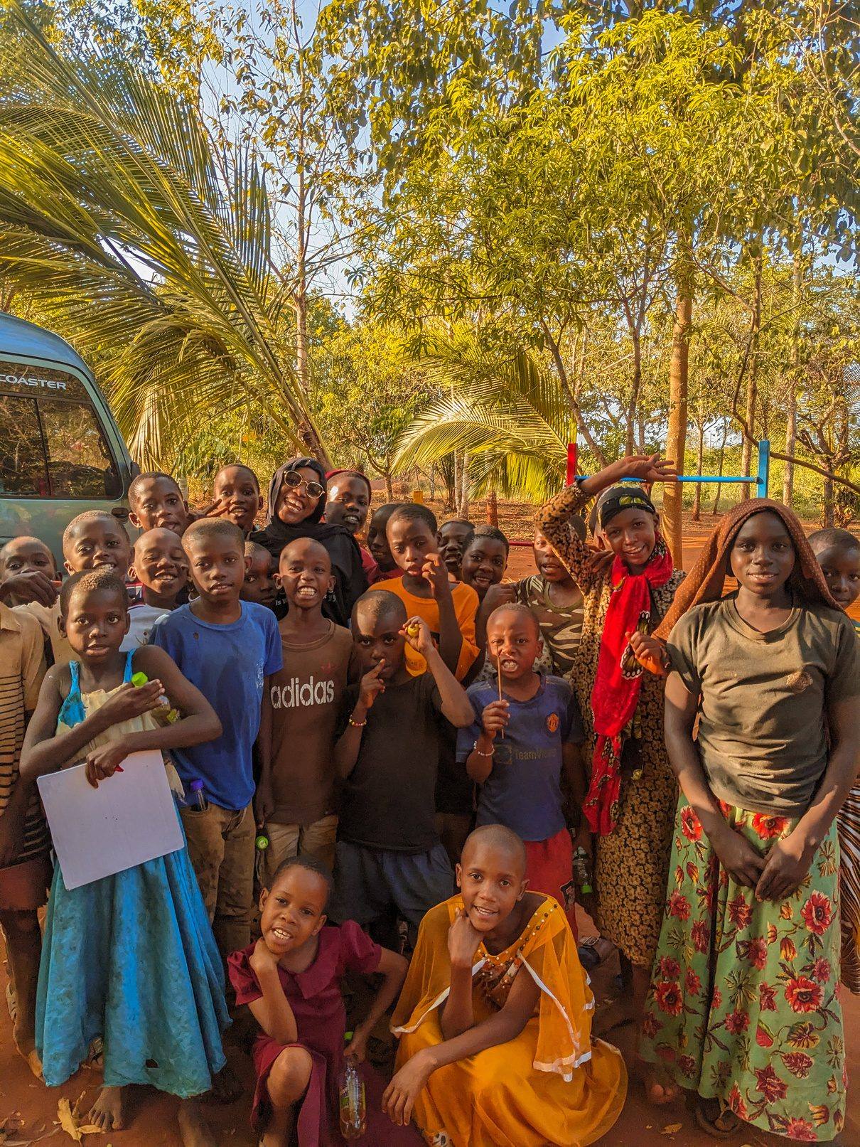 Friends Forever Foundation volunteers with children in a Tanzanian community